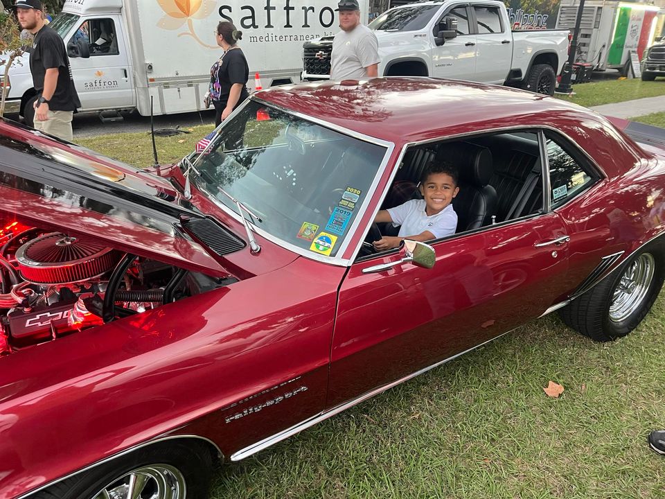 Child in antique car during the 150th Anniversary Kickoff Event